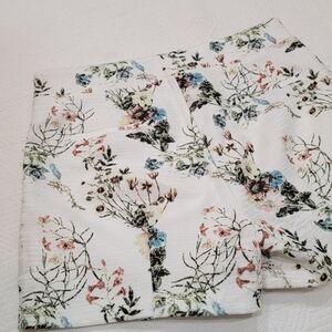 Lucy Paris white floral shorts.